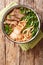Easy Recipe forÂ Lanzhou Beef Noodle Soup closeup in a bowl. Vertical top view